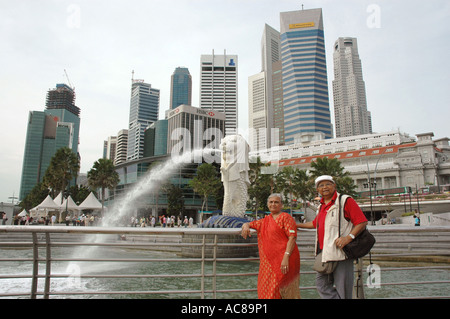 SMA79118 Mr and Mrs Shashikant Mehta Old Indian couple standing near Merlion statue in Merlion park Singapore Model Release Stock Photo