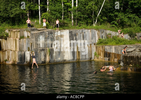 Teens swimming in former Dorset marble quarry oldest in USA Rutland County Vermont Stock Photo