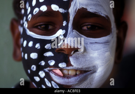 Aboriginal child with face paint blue yellow 1447 Stock Photo - Alamy