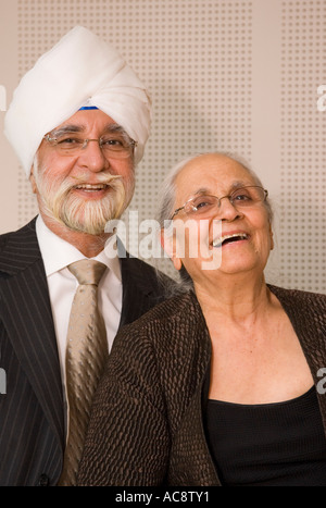 Portrait of Senior Sikh Couple Dressed in Western Clothes Stock Photo