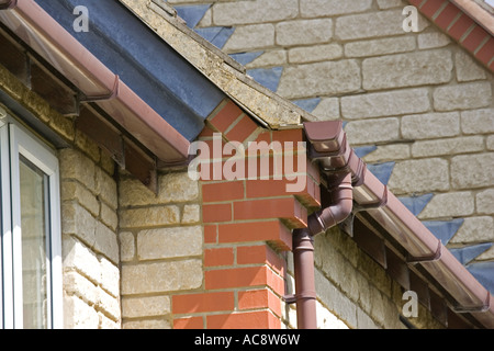 Corbelling or brickwork corbels at gable corners of house Woodmancote UK Stock Photo