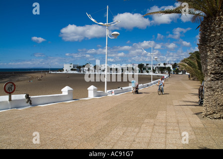 dh  PLAYA HONDA LANZAROTE Cyclist and walker on promenade Playa Honda seafront Stock Photo