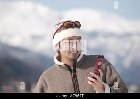 Young man using mobile phone Stock Photo