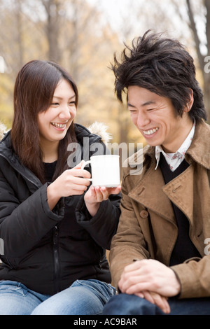 Young couple sharing cup of coffee Stock Photo