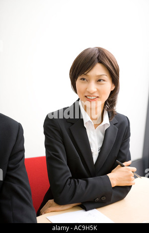 Young businesswoman in meeting Stock Photo