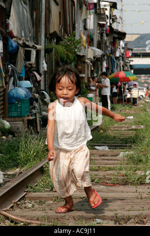 Girl on the track, Blumentritt, Manila, Philippines Stock Photo