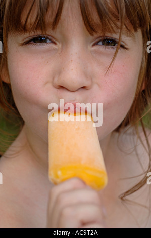 Close up of a child sucking a lollipop Stock Photo