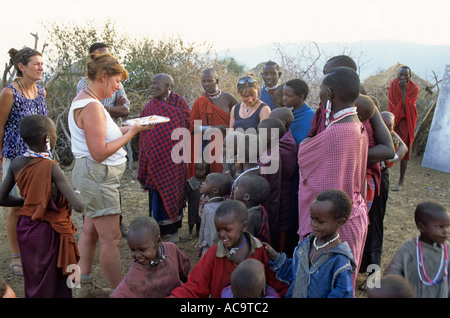 Tourists mixing with the Maasai, near Mto wa Mbu, Tanzania Stock Photo