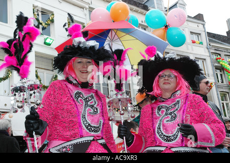 Two pink ladies celebrating carnival at Vrijthof square Maastricht Netherlands Stock Photo