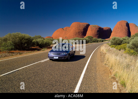 PKW driving on a street in Uluru - Kata Tjuta National Park, Northern Territory, Australia Stock Photo