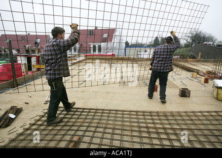 Rebar workers installing reinforcing mat for an apartment house, Essen, North Rhine-Westphalia, Germany Stock Photo