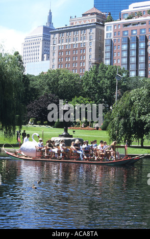 gliding over the lake in Swan boats is a popular recreation by visitors and locals in Boston's Public Gardens,Massachusetts,USA Stock Photo