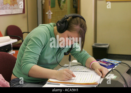 Female 6th form college student with headphones Stock Photo