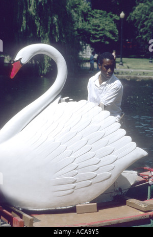 Swan boats are a familiar sight on the lake in Boston's Public gardens Stock Photo