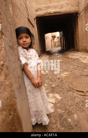 Girl in the old quarter of Kashgar in xinjiang China Stock Photo
