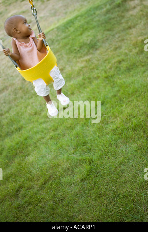 Baby in swing Stock Photo