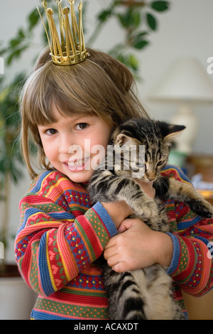 Girl with young domestic cat