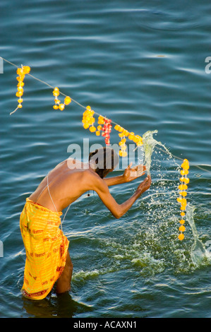 Aerial view of a Sadhu washing and praying at one of the ghats around Lake Pushkar. Stock Photo