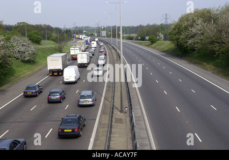 Heavy traffic on the M1 motorway northbound with few cars on the opposite carriageway uk Stock Photo