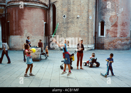 Venice Italy Children playing games in Campo San Giacomo dell'Orio in the quarter of Santa Croce Stock Photo