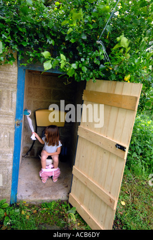 Toilet, Outside toilet, girl using an outdoor toilet Stock Photo ...