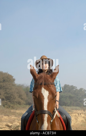 Portrait of a teenage girl riding a horse Stock Photo