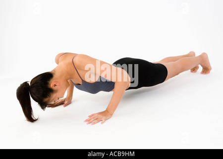 Woman doing push ups Stock Photo