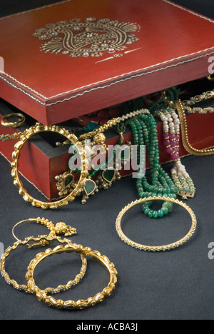 Close-up of jewelry spilling from a box Stock Photo