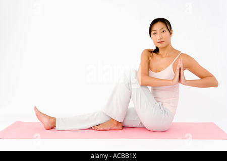 Woman doing yoga Stock Photo