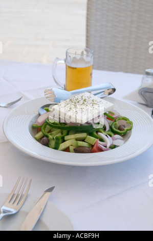 A typical Greek salad topped with Feta cheese Stock Photo