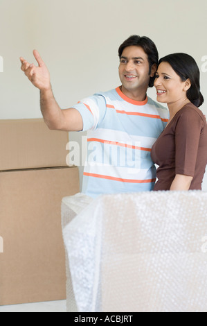 Mid adult man standing with a young woman Stock Photo