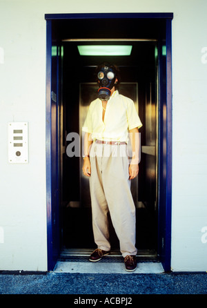 portrait of man with protective facemask symbolism for pollution of environment Stock Photo