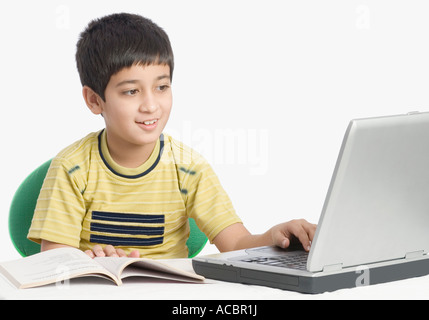 Boy using a laptop Stock Photo