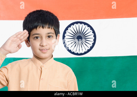 Close-up of a boy saluting in front of the Indian Flag Stock Photo ...