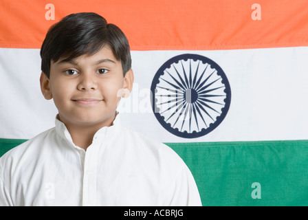 Boy in front of Indian Flag saluting Stock Photo - Alamy