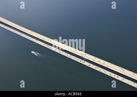 Aerial view of boat speeding along freeway bridge over Lake Washington Seattle Wa Stock Photo