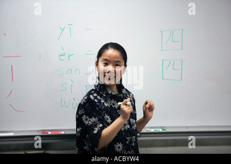 A teacher teaches Mandarin Chinese to US Middle School students in an after school program Stock Photo