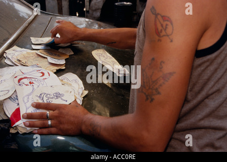 Palestinian tattoo artist with his designs, Shatila refugee camp, Beirut, Lebanon Stock Photo