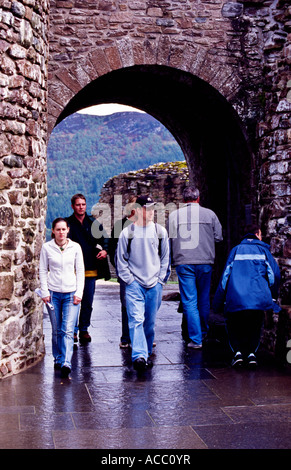 People walking through the archway Stock Photo