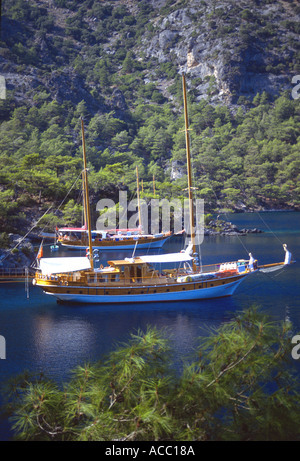 Gulet moored at Ruin Bay Cleopatras Baths Fethiye Bay Turquoise Coast Turkey Stock Photo