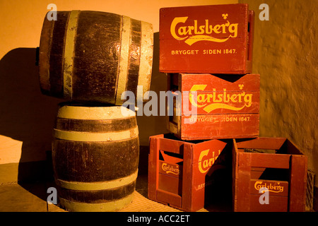 Old beer barrels and beer crates in the cellar at Carlsberg Visitor Centre Stock Photo