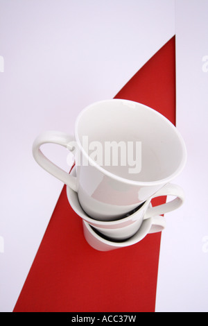 TOP VIEW WHITE COFFEE CUPS RED AND WHITE BACKGROUND VERTICAL BDB11046 Stock Photo