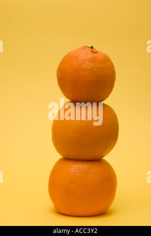 stacked up mandarin oranges concept financial balance Stock Photo