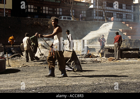 Road builders in Thimphu Bhutan Stock Photo