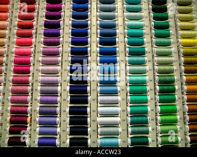 gaudy mixture of sewing thread in different colours Stock Photo