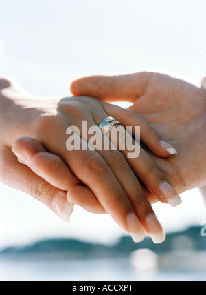A bridal couple holding hands. Stock Photo