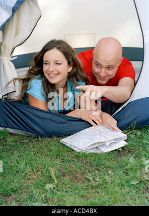 A smiling couple in a tent. Stock Photo