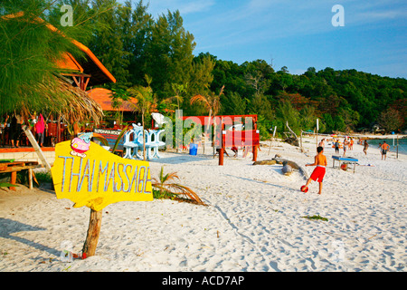 Thai massage sign and tourist on beach, Ko (Koh) Lipe, Andaman Sea, Thailand Stock Photo