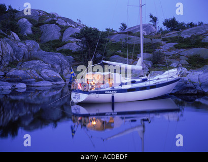 Sailboat anchored off small island at Stora Nassa in Stockholm Archipelago Stock Photo