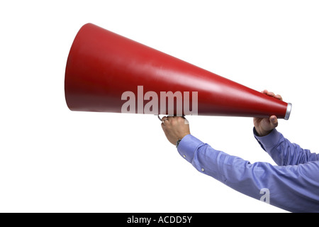 Hands holding megaphone cut out on white background Stock Photo